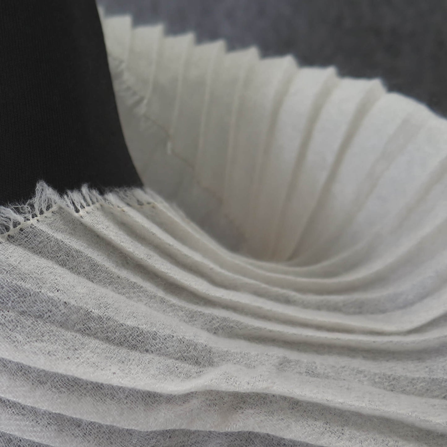 Delicate pleated Cashmere wrap. Light cream with fringing and angled ends