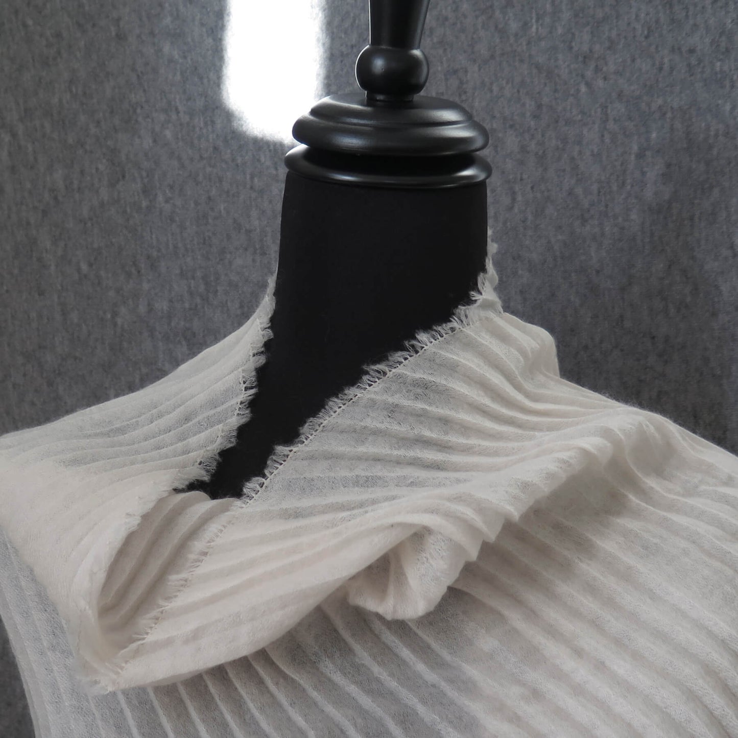 Delicate pleated Cashmere wrap. Light cream with fringing and angled ends