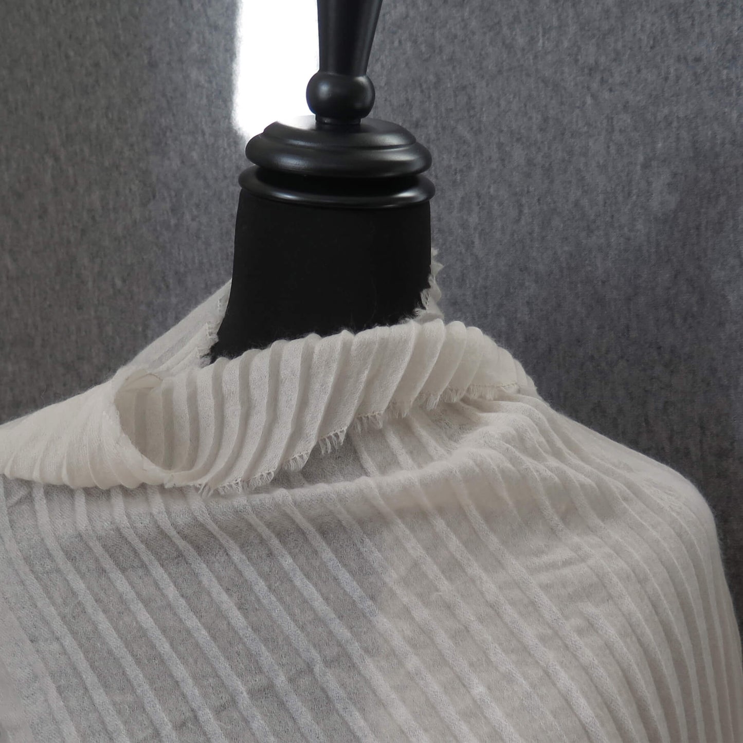 Delicate pleated Cashmere wrap. Light cream with fringing and angled ends