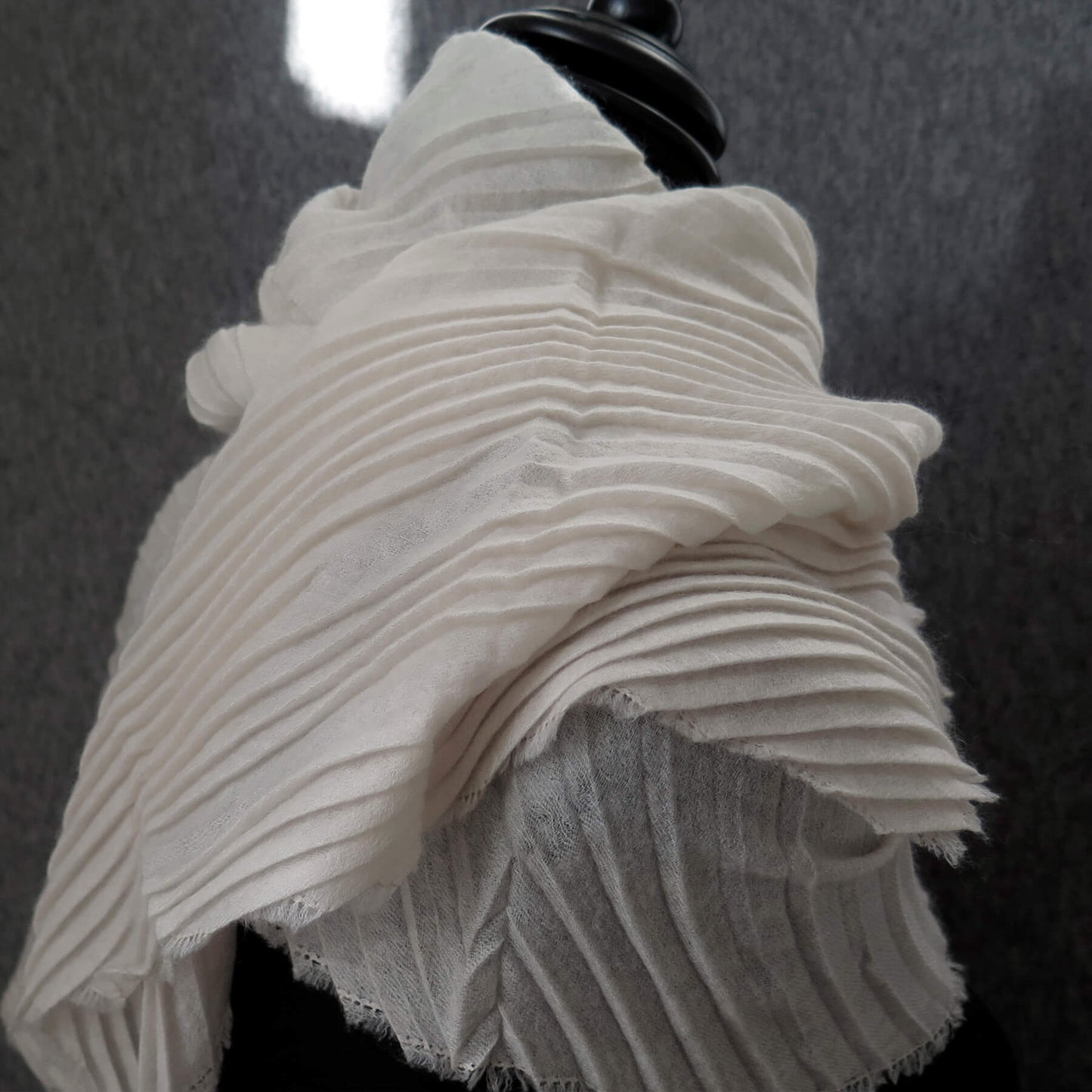 Delicate pleated Cashmere wrap. Light cream with fringing and angled ends