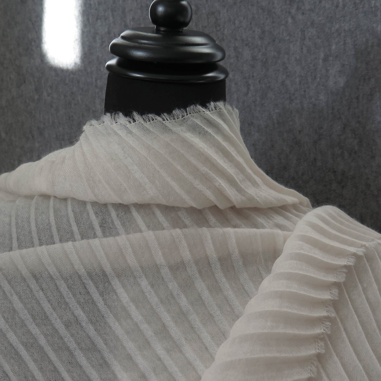 Delicate pleated Cashmere wrap. Light cream with fringing and angled ends