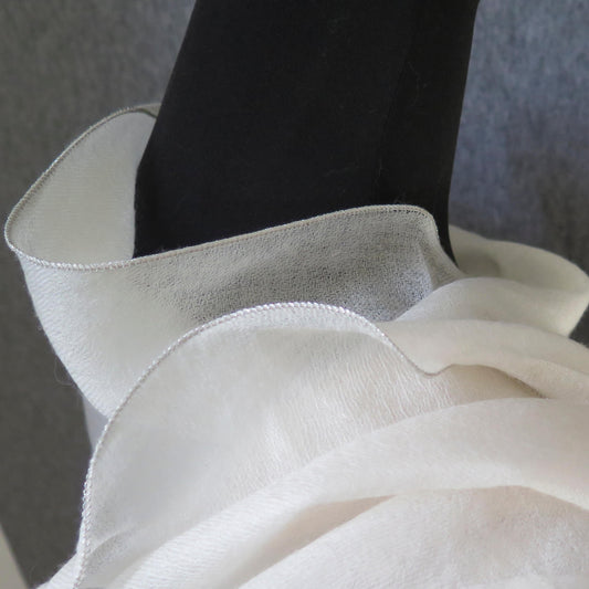 Luxurious Cashmere wrap. Light cream with fine silver waved edge