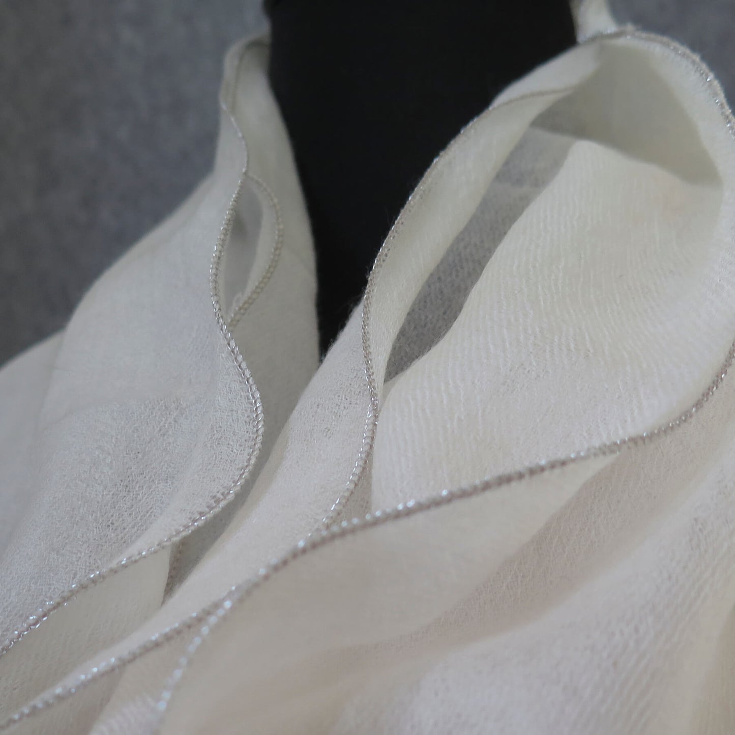 Luxurious Cashmere wrap. Light cream with fine silver waved edge