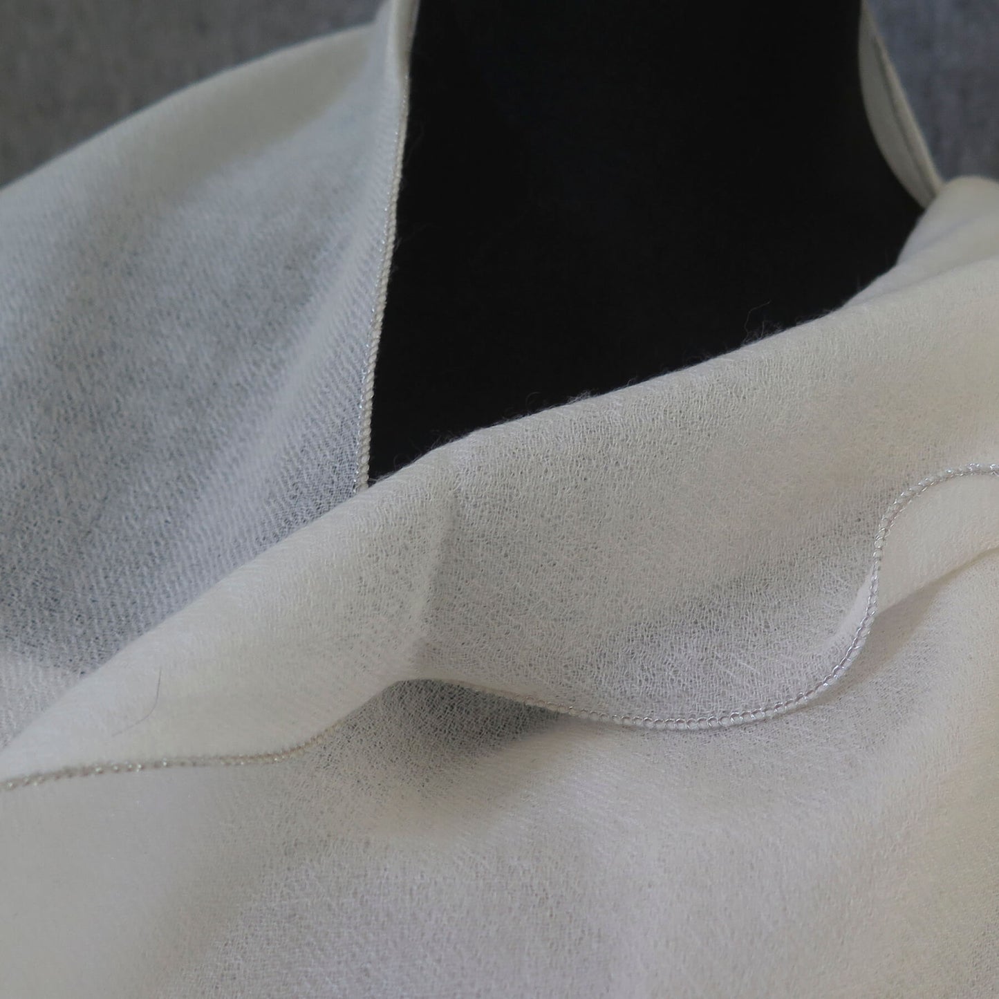 Luxurious Cashmere wrap. Light cream with fine silver waved edge