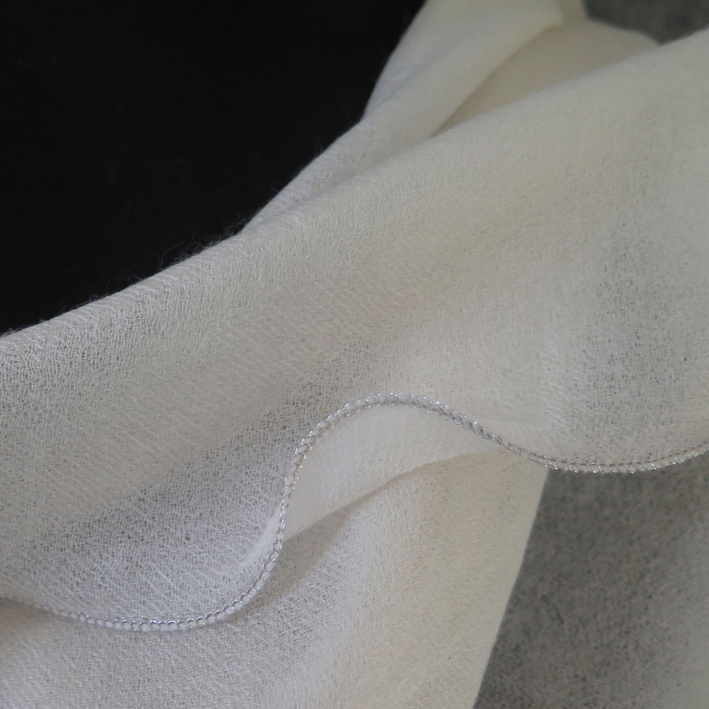 Luxurious Cashmere wrap. Light cream with fine silver waved edge