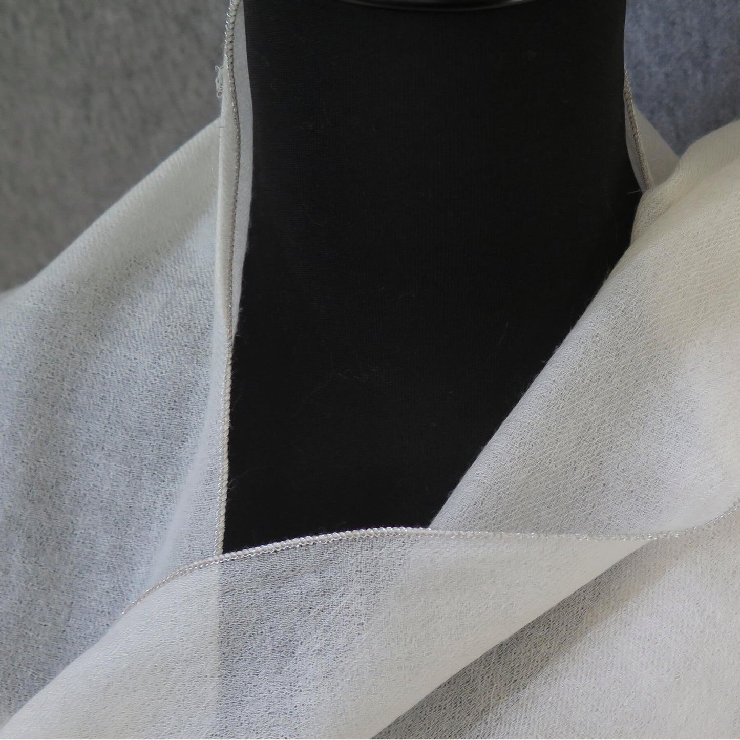 Luxurious Cashmere wrap. Light cream with fine silver waved edge