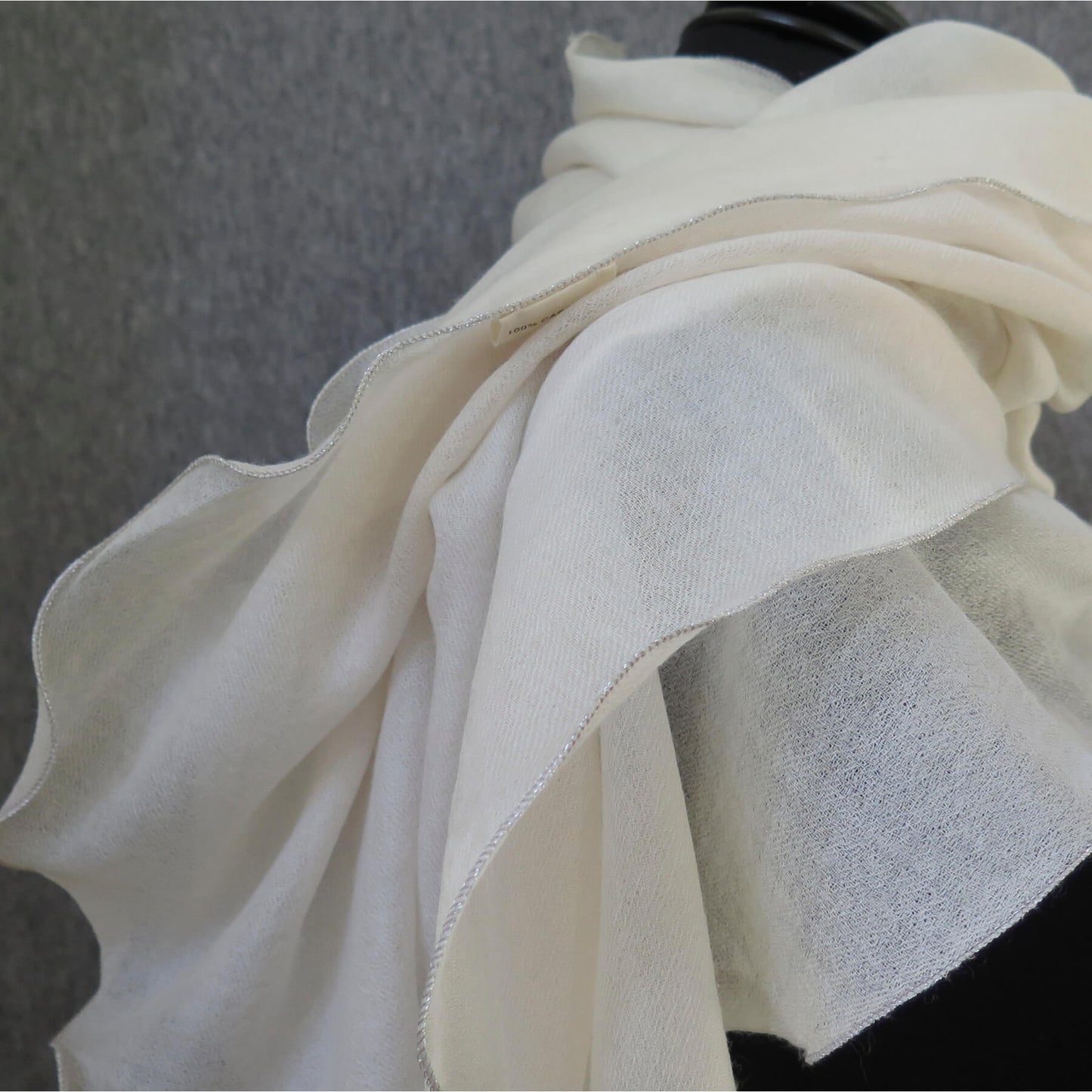 Luxurious Cashmere wrap. Light cream with fine silver waved edge