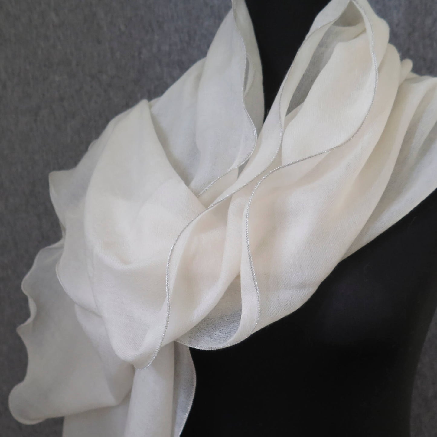 Luxurious Cashmere wrap. Light cream with fine silver waved edge